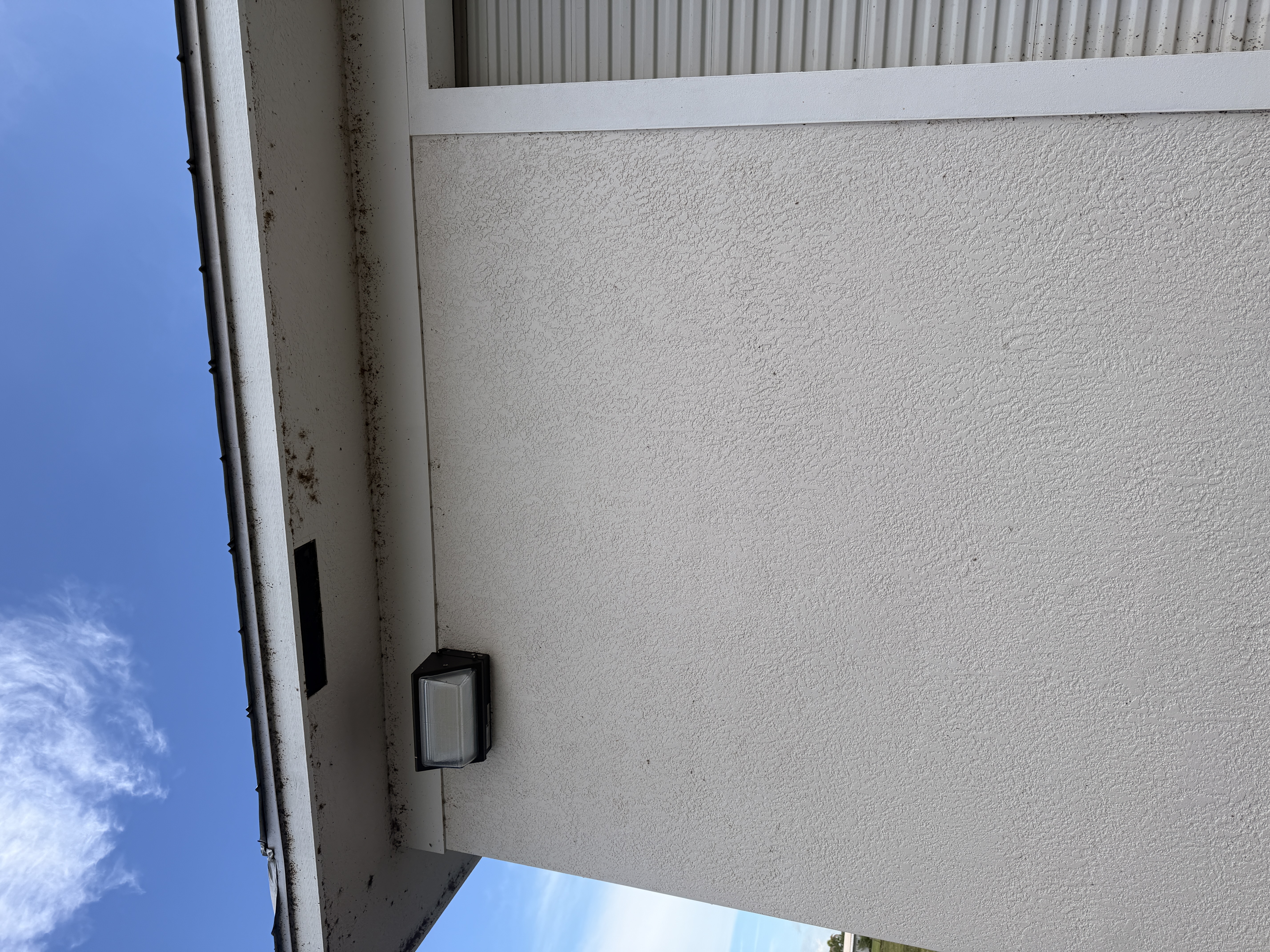 commercial building exterior before soft washing Treasure Coast FL