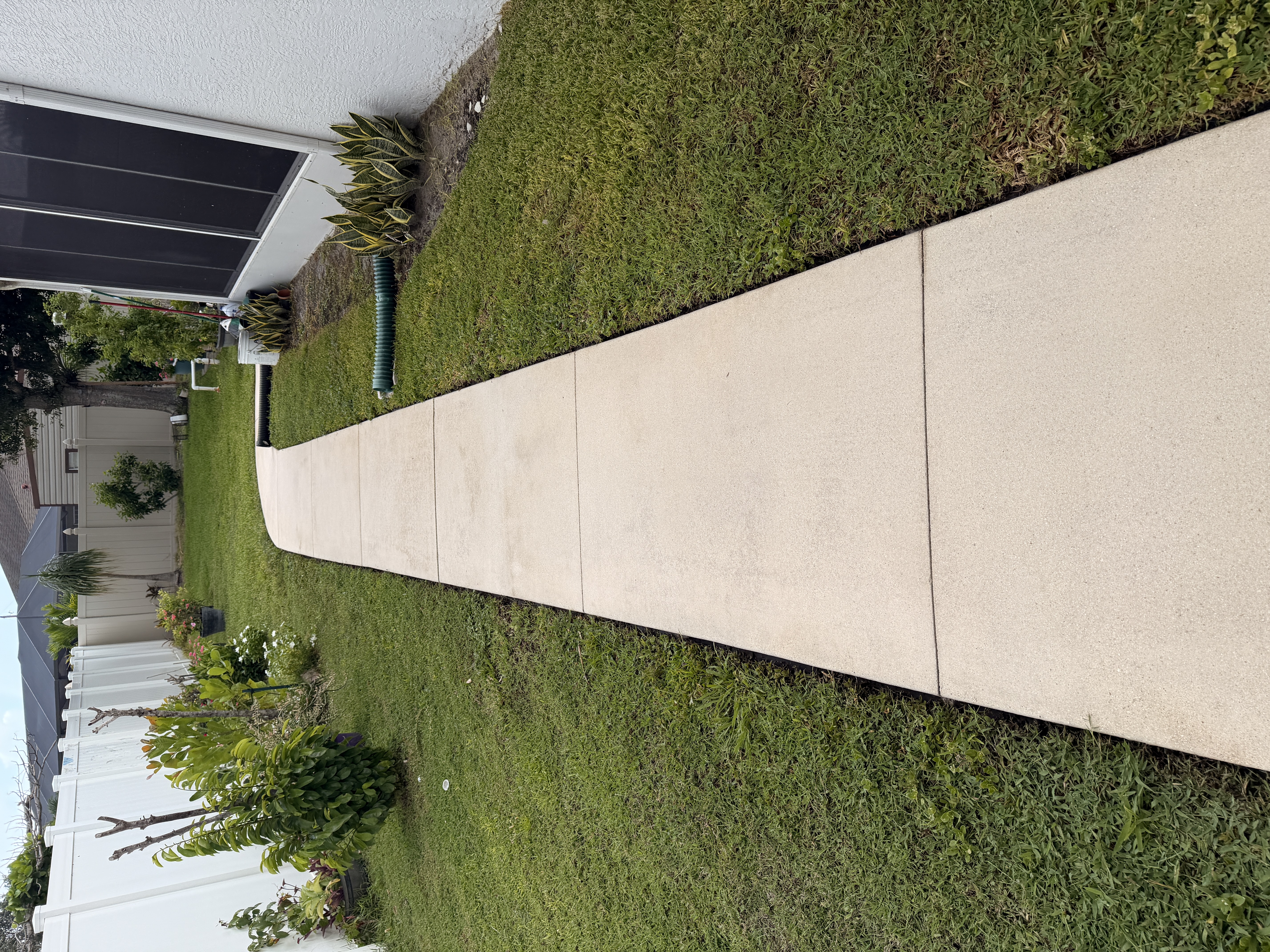 clean concrete walkway after pressure washing Port Saint Lucie FL